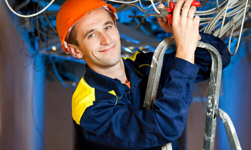 Construction repairman with a combination pliers on a stepladder